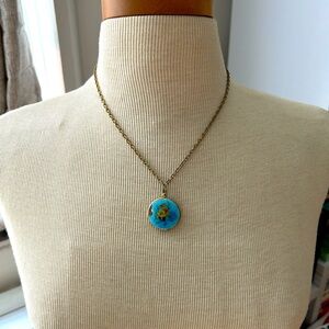 Floral blue locket necklace